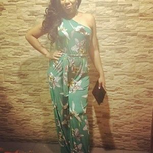 Green one shoulder jumpsuit. Runs big.